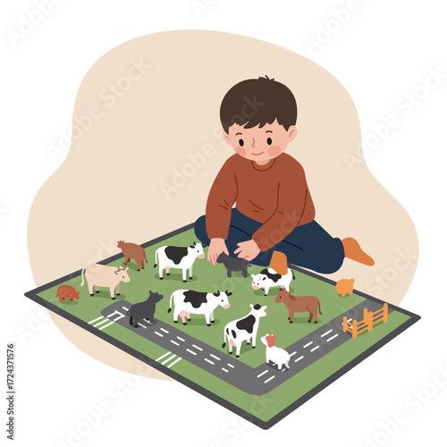 Boy playing with toy cows on a green road-printed mat indoors