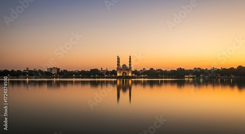 Fototapeta Naklejka Na Ścianę i Meble -  Golden Hour Hyderabad Skyline over Hussain Sagar Lake
