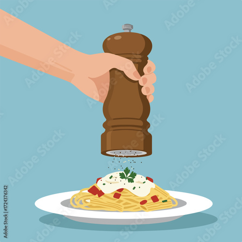 Hand grinds pepper over pasta on white plate, light blue backdrop