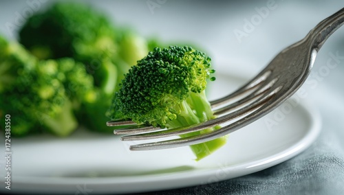 Fresh broccoli florets on a fork
