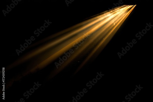 Golden light rays on black background