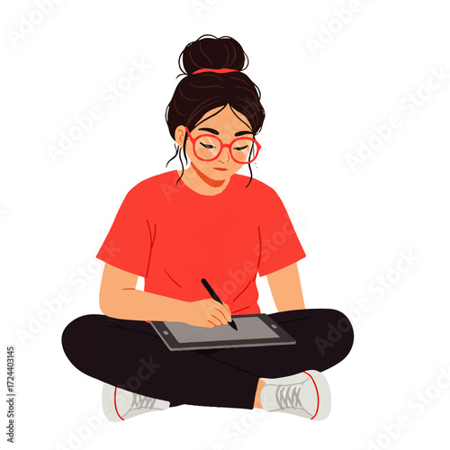 A young woman with glasses and a hair bun sits cross-legged, drawing on a digital tablet with a stylus.