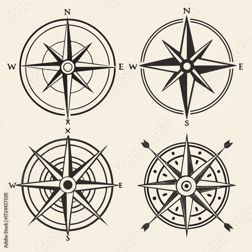 Four vintage compass rose designs with cardinal directions north east south west and directional points displayed on a cream background
