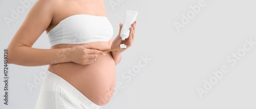 Pregnant woman with tooth brush and paste on light background with space for ...