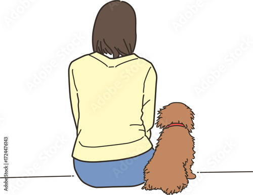 ペットの犬と座る若い女性の後ろ姿