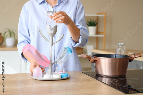 Woman with drying rack for ...