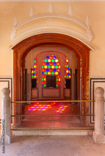 Warm Interior Archway Framing a Stained Glass Window 