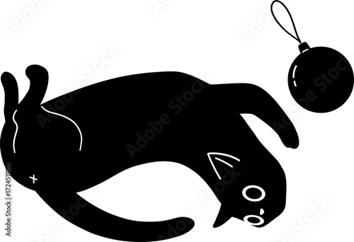 Black cat silhouette playing with a Christmas ornament