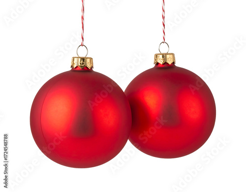 Two red Christmas ornaments hanging