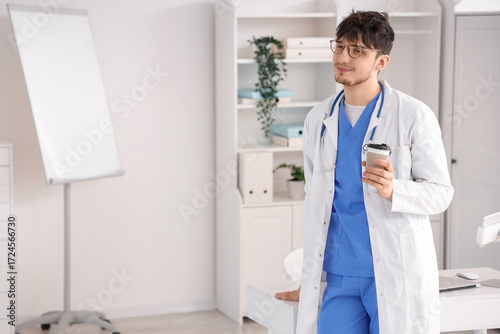 Dreaming male doctor with c...