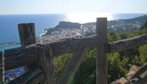 Coastal town view through wooden fence