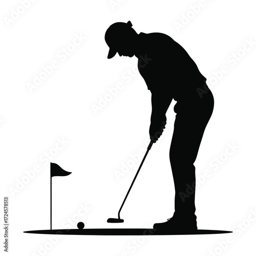 Golfer silhouetted while putting on a green