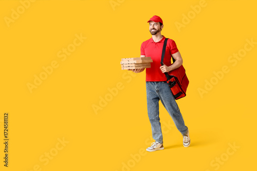 Male courier with pizza box...