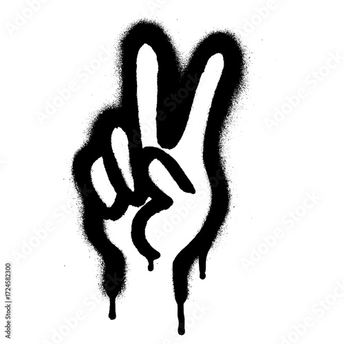 Black graffiti stencil of a hand making the peace sign, spray painted on a white wall with dripping paint effect.
