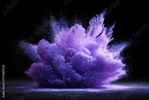 Explosion of purple powder on a dark background