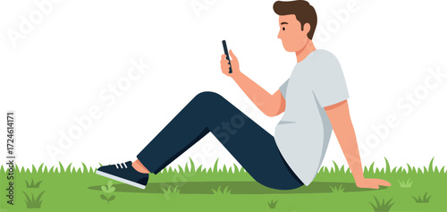 Man sitting on grass looking at phone.