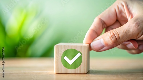 Hand placing wooden block with check mark symbol on a wooden surface