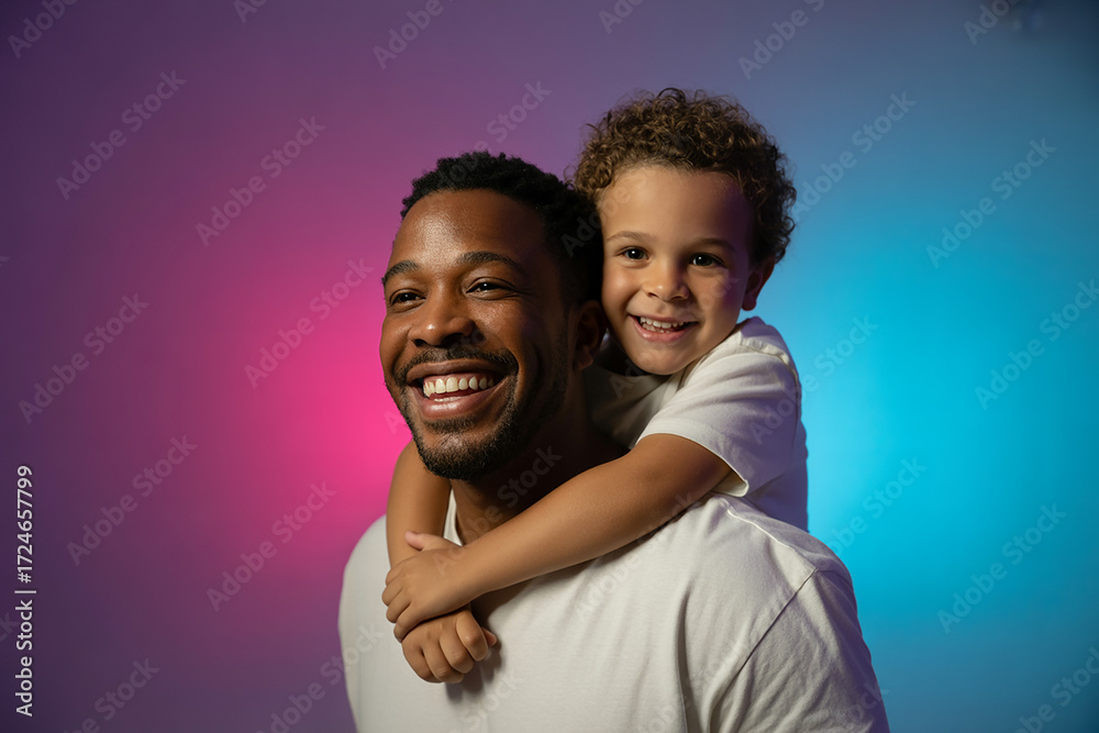 Obraz premium Happy father and son embracing with colorful background