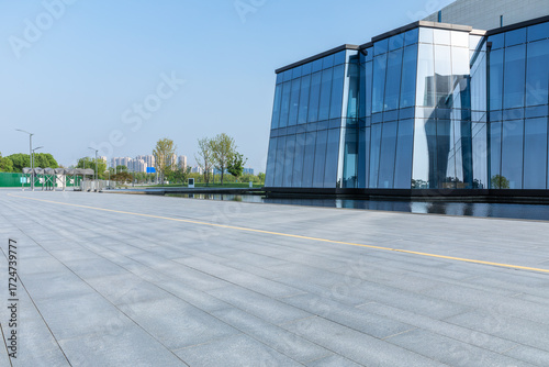 Wallpaper Mural Empty square floor and modern city glass wall buildings Torontodigital.ca