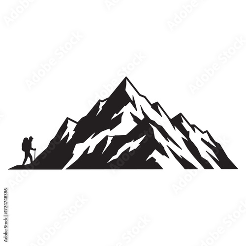 Hiker silhouette beside a large mountain range trekking