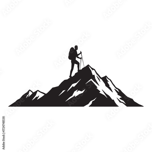 Hiker silhouette on a mountain summit with surrounding peaks