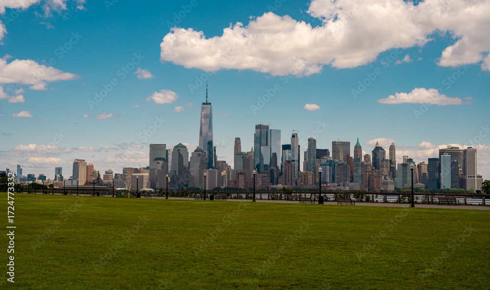 Obraz premium New York City. NYC skyline with towering skyscrapers. Manhattan and Hudson River. Panoramic cityscape of New York. Downtown NYC with landmarks. New York skyline. New York reflecting skyscrapers.