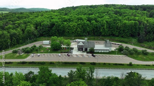 Wallpaper Mural Aerial drone view of rest area with trucks, cars, and forest in Maine USA Torontodigital.ca