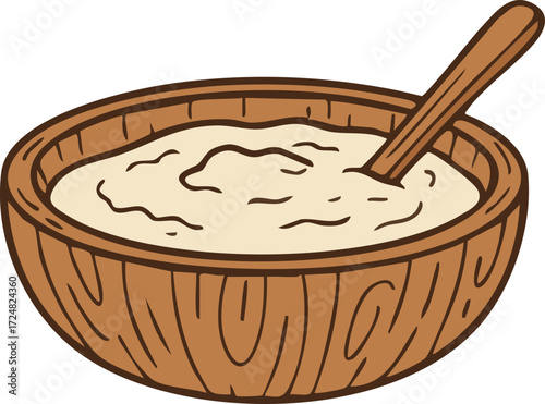 Wooden bowl of rice pudding with spoon
