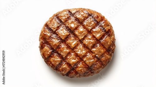 A juicy grilled burger patty, shown from above, set against a plain white backdrop.
 