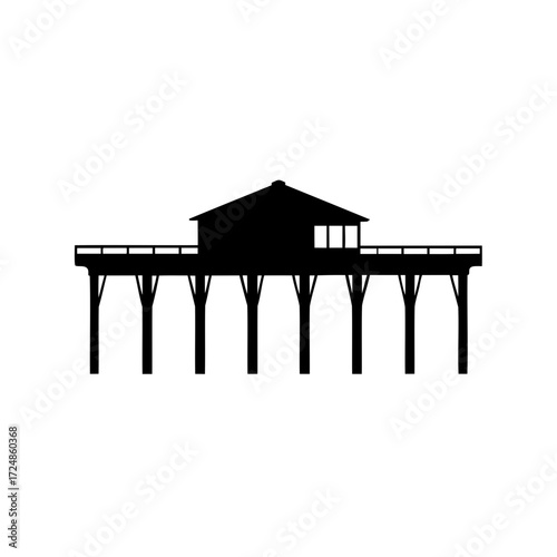 Silhouette of a wooden pier structure reaching out into the water