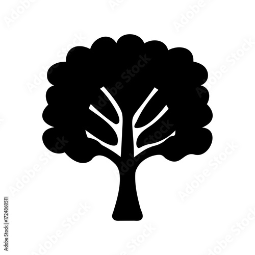 A silhouette of a tree with a full crown and branches