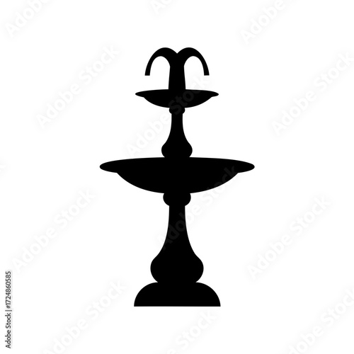 Silhouette of an ornate tiered water fountain, classic design, elegant garden feature