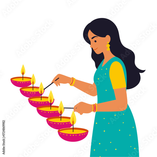 Smiling Indian woman lights multiple traditional diya lamps celebrating Hindu Diwali festival of lights.