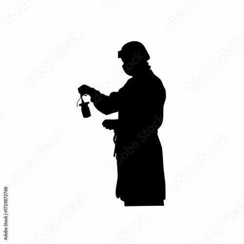 Silhouette of lab worker sanitizing hands isolated on white background