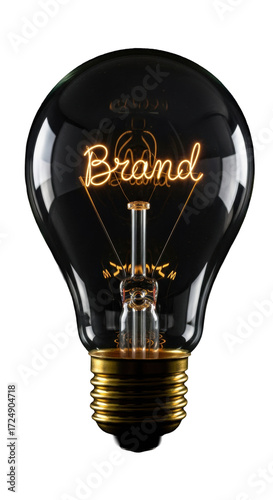 Vintage clear glass light bulb, glowing filament spelling 