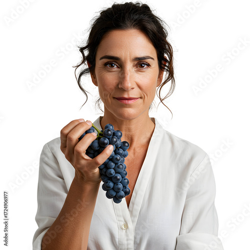 Woman smiling holding a bunch of dark grapes on white or transparent background