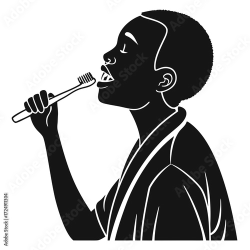A young black boy in silhouette wearing a robe brushes his teeth with a toothbrush symbolizing morning routine and personal hygiene