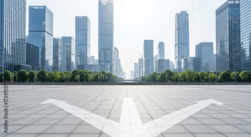 A wide shot of a modern city with tall skyscrapers and a directional arrow.