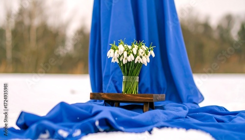 Snowdrops in a vase, winter scene
