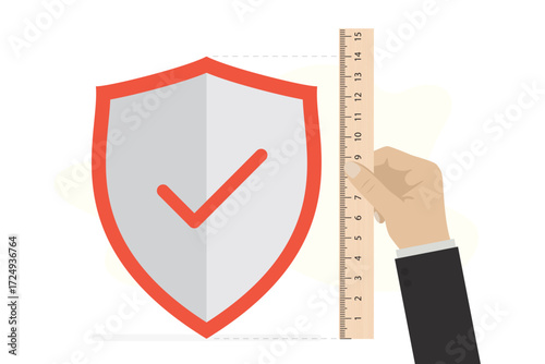 High level of security. Human hand uses wooden ruler and measures level of protection. Protective shield, high level of protection against hacker attacks, scams, cyber crime