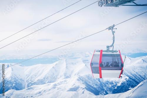 Modern gondola lift connecting Kobi and Gudauri in Caucasus mountains Georgia, scenic ski resort transport with snowy peaks, popular winter tourism, skiing and snowboarding travel destination.