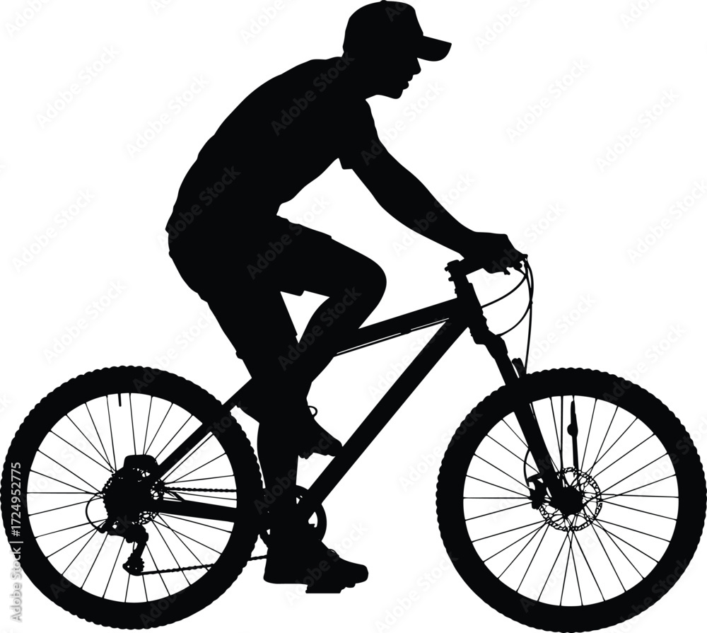 Obraz premium Silhouette of a person wearing a cap riding a mountain bike with enthusiasm and energy