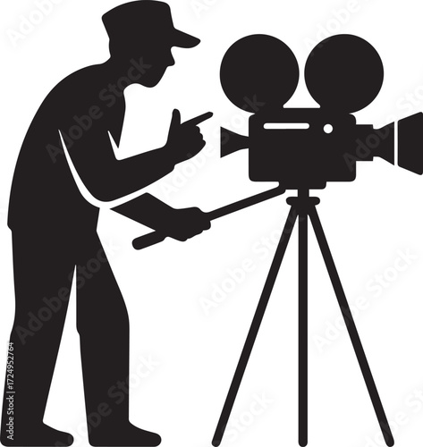 Filmmaker silhouette directing a classic movie camera on a tripod in a studio