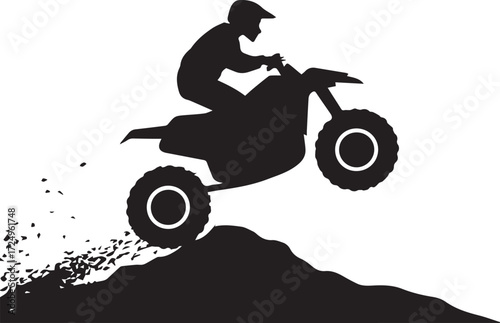 Silhouette of an atv rider mid-air performing a jump over a dirt mound