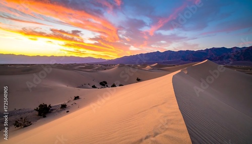 Fototapeta Naklejka Na Ścianę i Meble -  Dramatic sunset over desert dunes