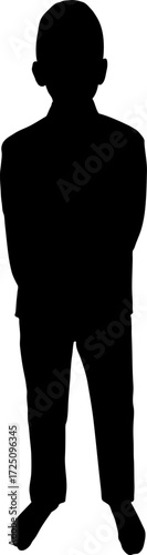 Silhouette of a young boy standing with hands back 