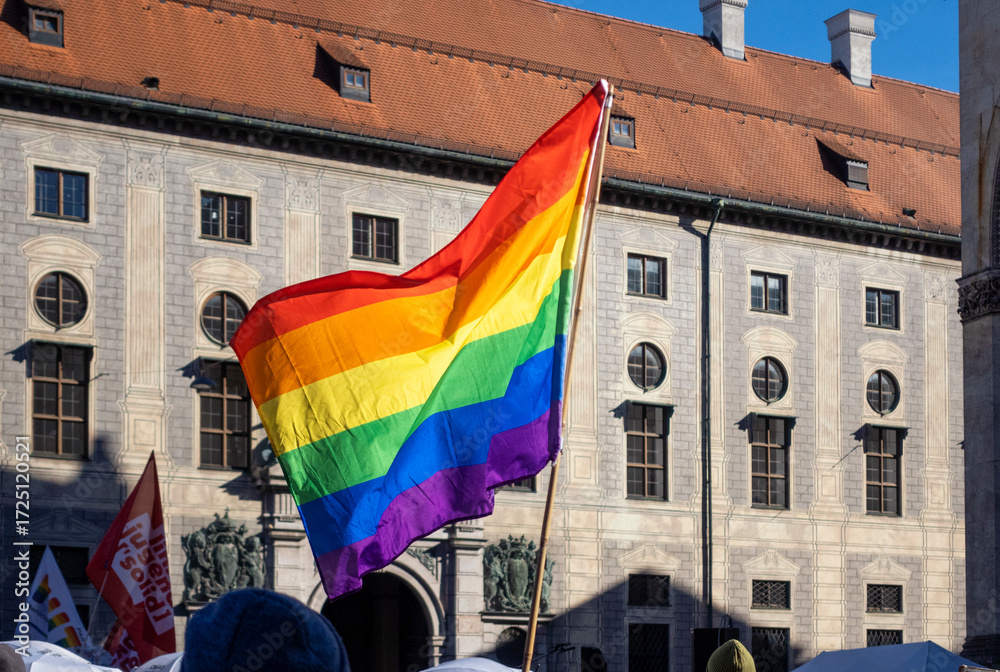 LGBTQ flag waving at political protest in Munich Bavaria Germany LGBTQ flag waving at political protest in Munich Bavaria Germany