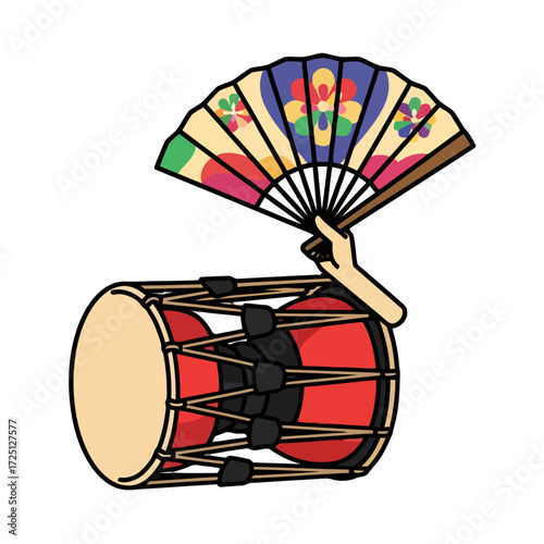 Hand holding colorful folding fan above traditional korean drum, representing cultural performance and artistic expression