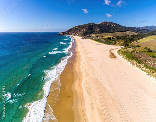Aerial View of Sandy Beach and Turquoise Ocean