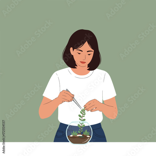 Person building terrarium
